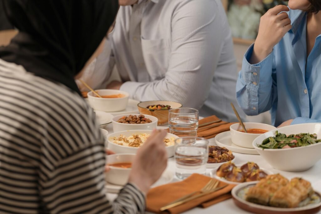 A relaxed meal setting with friends, enjoying diverse dishes and lively conversation.