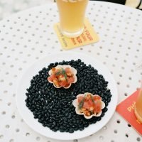 Gourmet appetizers on black beans with craft beer on a summer day. Perfect for culinary enthusiasts.